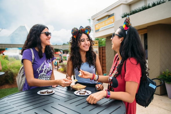 Girls eating at Food and wine Festival