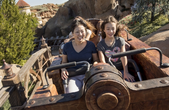 Girl from Modern Family and mother on Seven Dwarves Mine Train